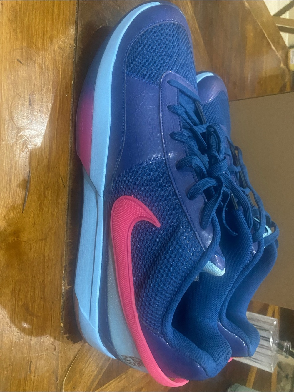 Nike style code FV1286-400 is the Nike Ja 1 "NY vs. NY" basketball shoe
